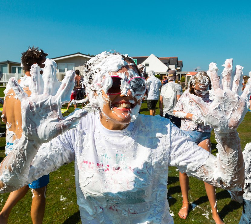 A hot summer day with a group of people covered in custard pie! As part of the many events and activities we offer at our holiday parks.