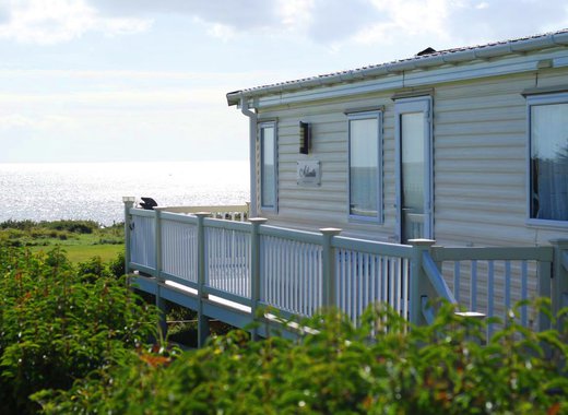 One of our classic holiday homes looking out to sea at our Essex holiday park, Mersea Island.