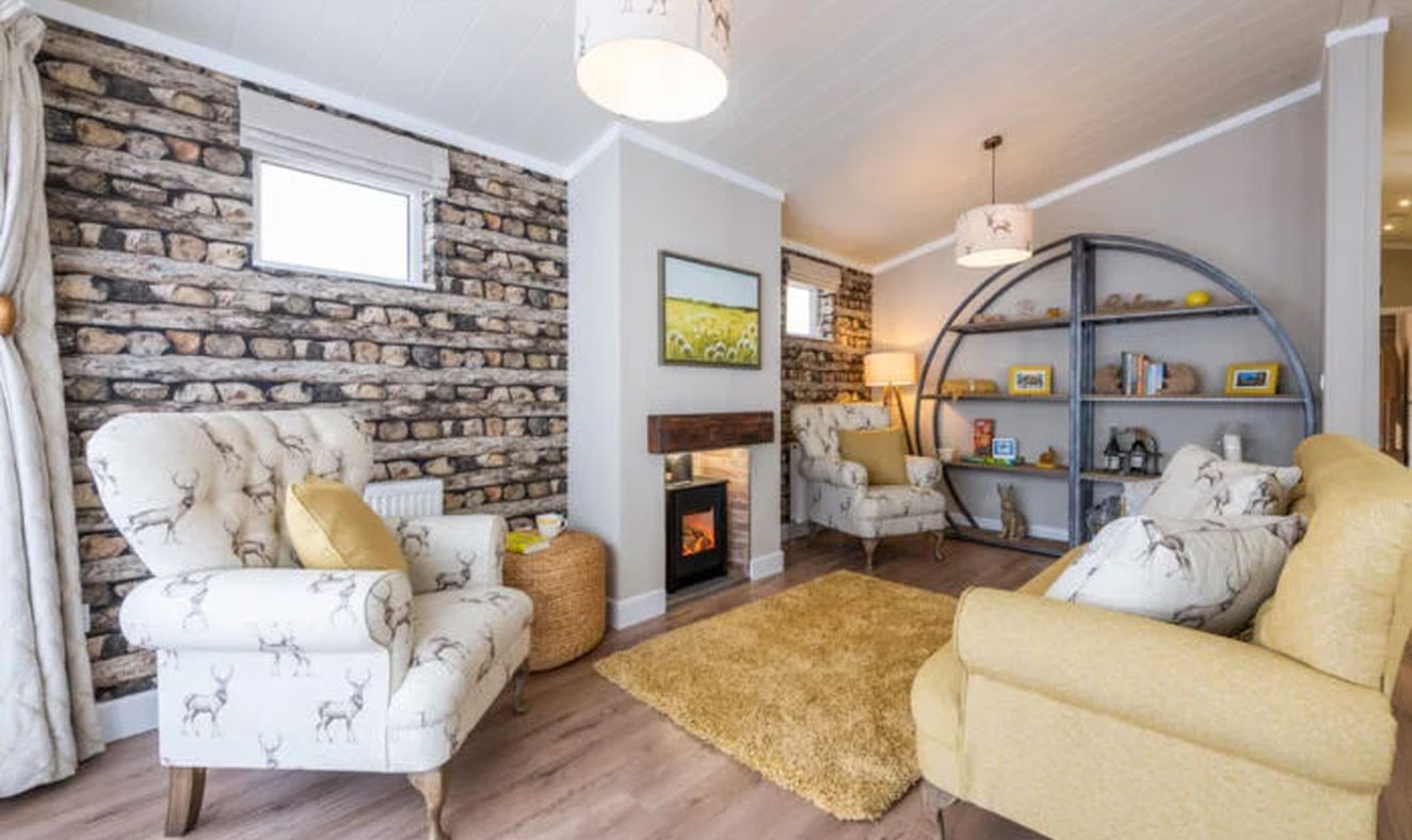 The lounge area of our bright and spacious luxury rooftop lodge at Swanage Bay View. The perfect way to stay.