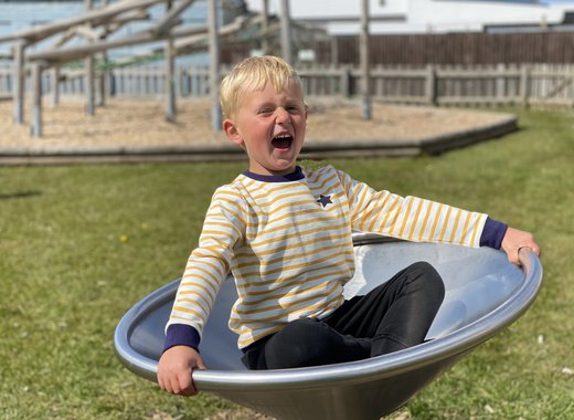 A young boy playing in the park.