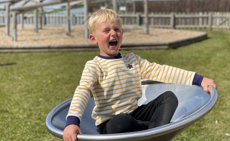 A young boy playing in the park.