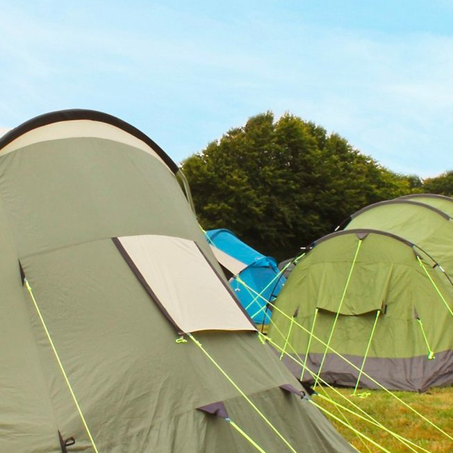 
                Two tents pitched at one of our holiday parks.
                