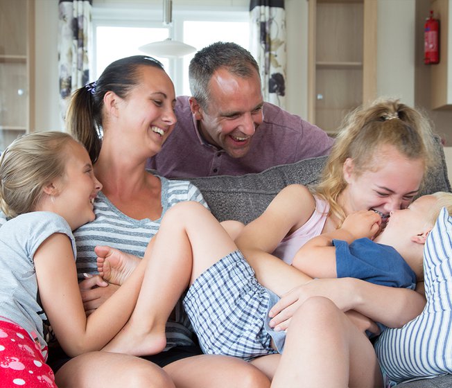 A young family enjoying themselves in one of our holiday homes. You too can experience summertime happiness with Away Resorts!