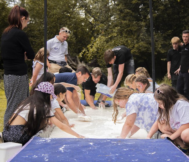 A group of people participating in a group activity.