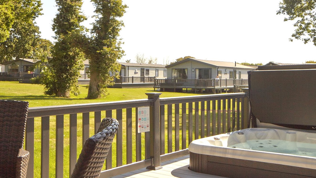 
              The decking with a hot tub of one of our stunning accommodations at St Helens Coastal Resort.
              