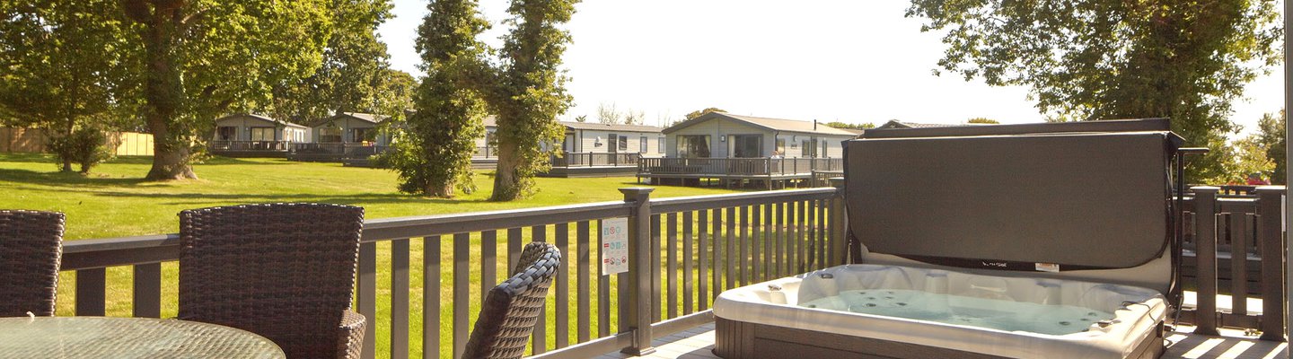 
          The decking with a hot tub of one of our stunning accommodations at St Helens Coastal Resort.
          