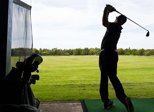 A person enjoying an afternoon at The Driving Range at Appletree Holiday Park, Lincolnshire.