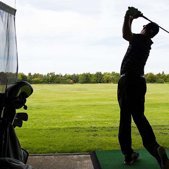 
                A person enjoying an afternoon at The Driving Range at Appletree Holiday Park, Lincolnshire.
                