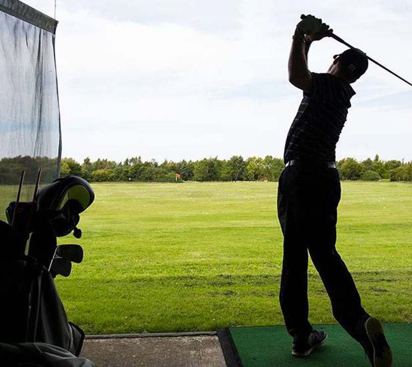 A person enjoying an afternoon at The Driving Range at Appletree Holiday Park, Lincolnshire.