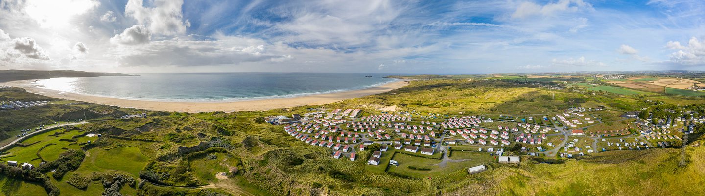 
          An aerial view of our stunning park, St Ives Bay on a sunny day
          