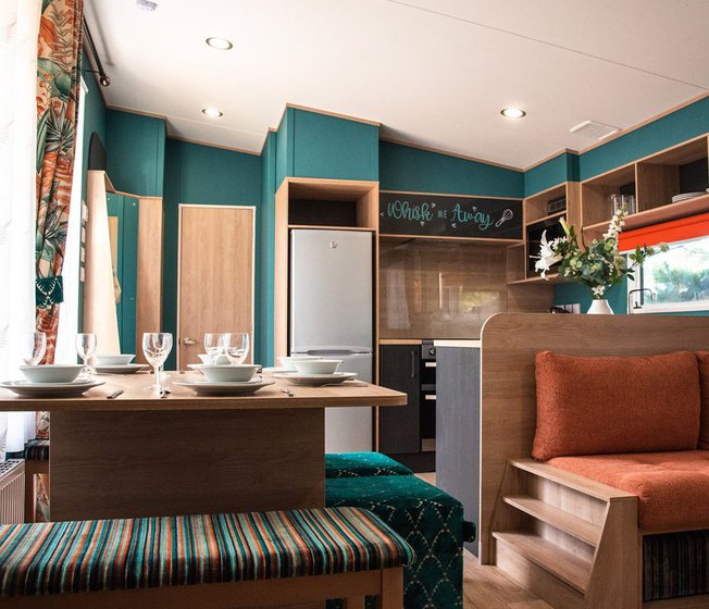 The living and dining area of our bright and spacious Exclusive accommodation, The Burst of Blue. The perfect way to stay.