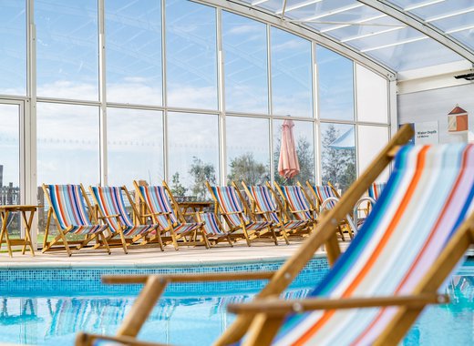 A close up image of a deck chair inside our indoor swimming pool at Mersea Island.