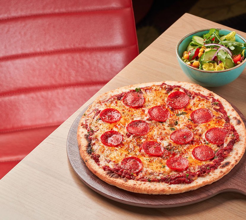 We offer a delicious range of tasty food and drink, like our freshly prepared pepperoni pizza with side salad. You can find our menus online when you book a holiday with us.