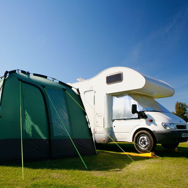 
                A tent and tourer in one of our holiday parks.
                