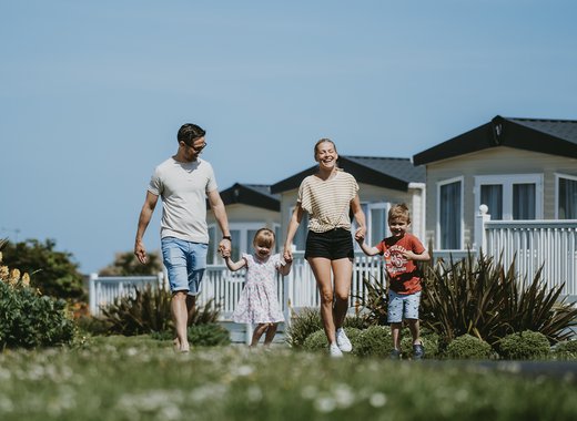 Family walking through our Newquay Bay Holiday Park.