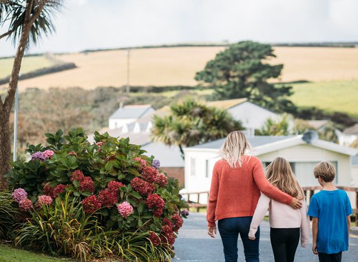 Family walking through Newquay Bay Holiday Park.