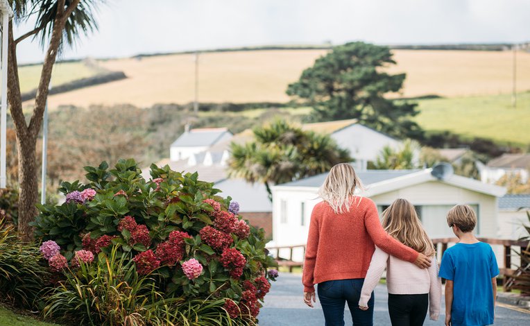 Family walking through Newquay Bay Holiday Park.