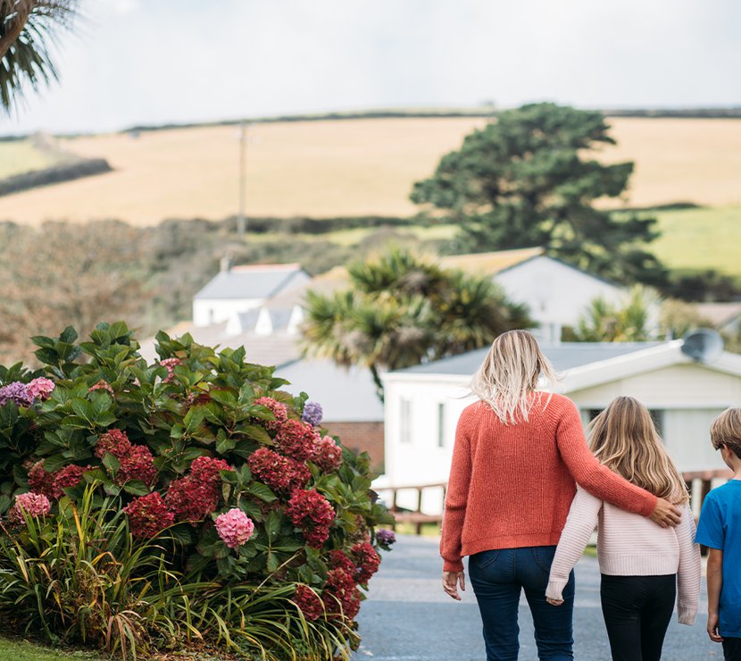 Family walking through Newquay Bay Holiday Park.