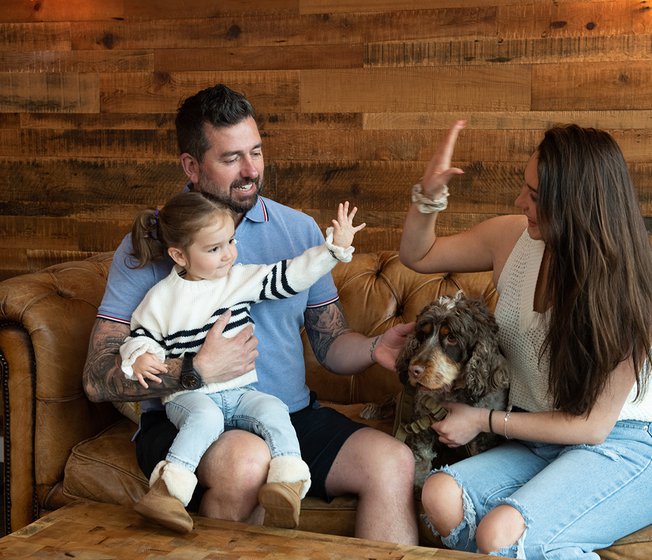 A family enjoying an afternoon at The Lookout Bar & Eatery at Retallack Resort, Cornwall.
