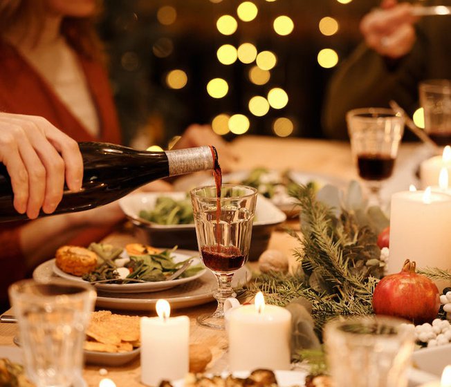 A close up of people enjoying a Christmas dinner