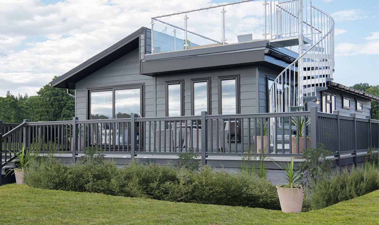 The exterior of our stunning Luxury Lodge with a roof terrace at Swanage Bay View, Dorset. Book your holiday now!