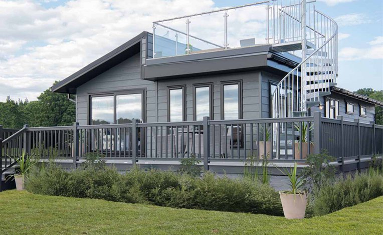 The exterior of our stunning Luxury Lodge with a roof terrace at Swanage Bay View, Dorset. Book your holiday now!