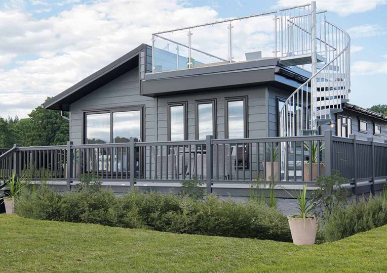 The exterior of our stunning Luxury Lodge with a roof terrace at Swanage Bay View, Dorset. Book your holiday now!