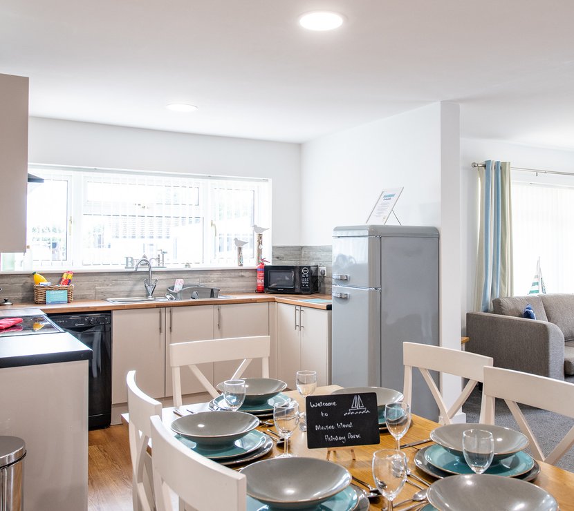 The kitchen and dining area of one of our spacious static caravans at Mersea Island. Book your holiday now!