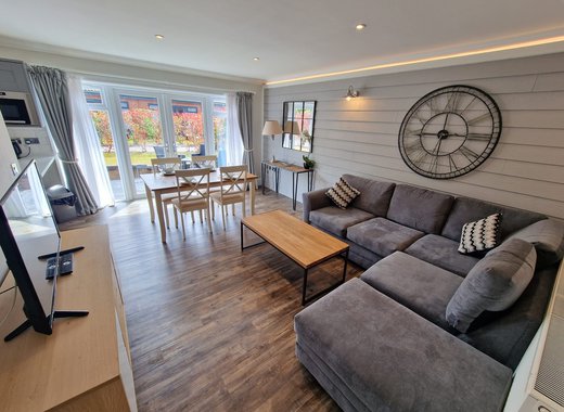 The lounge area of our stunning holiday home at The Lakes Rookley, the Island Cottage.