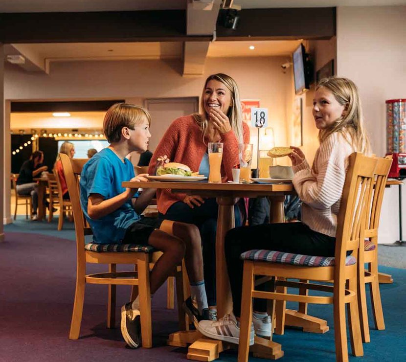 Family enjoying a bite to eat at our Newquay Bay Holiday Park.